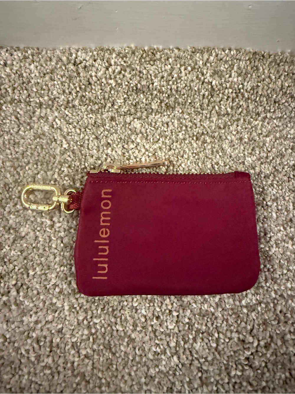 lululemon athletica burgundy zip key pouch with gold hardware